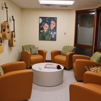 Gallery Photo of Participant lounge at our treatment hub and administrative headquarters. We love when participants play these guitars!