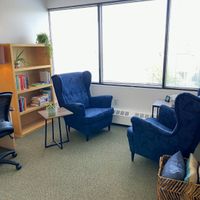 Gallery Photo of Comfortable Office Space, wingback chairs with arm rests, natural light