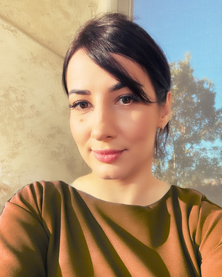 Photo of Olena Pkhaladze, Registered Psychotherapist, MACP, MSc, BCNLP, BCH