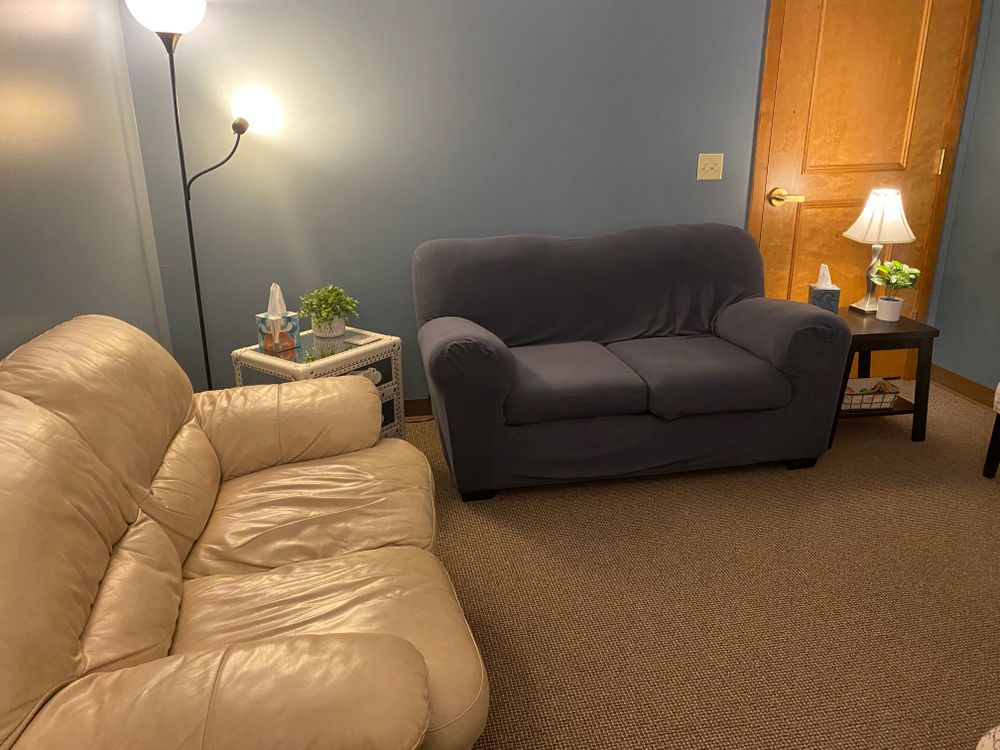 Here is a snippet of the therapeutic space for in-person sessions. Not pictured: Uno cards, coloring books, and a bucket of fidgets