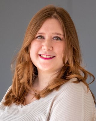 Photo of Dr. Brittany Olivia Bishop, Licensed Clinical Professional Counselor, LCPC, ATR-BC, CYT, PhD