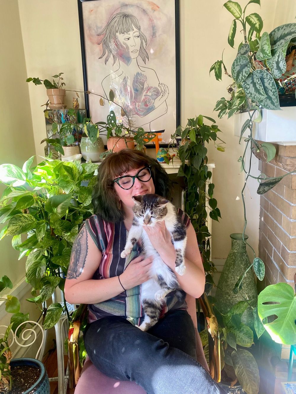 Me with my plants and my cat in my home office.