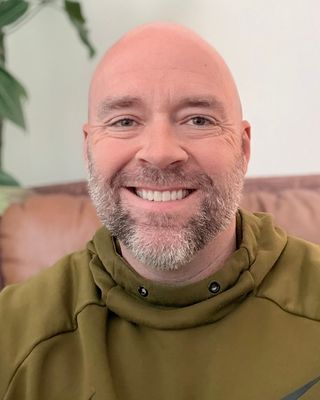 Photo of Brock Wettstead, Counselor, MA, LIMHP, CDGC