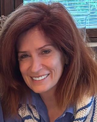 Photo of Dr. Emily Baker, Licensed Educational Psychologist, PsyD, EdS, LCSW, LEP, ABSNP