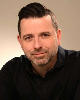 Photo of Thomson Scarlett, Registered Psychotherapist, MA, RP, RSW, CCC, C-OAMHP