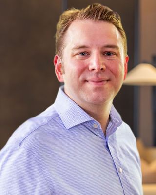 Photo of Dr. Justin Uzl, Psychiatrist, PMHNP