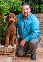 Gallery Photo of Brandon and his therapy dog, Ruby.