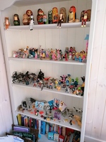 Gallery Photo of Bookcase with some of the collection of small world figure resources, used with sand tray therapy.