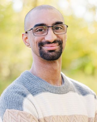 Photo of Naazim Shaffiq Kotadia, Counsellor, MC