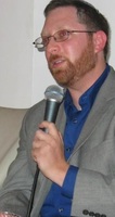 Gallery Photo of Speaking at a charity event to benefit youth at risk.