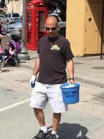 Gallery Photo of Bodhi Addiction's Co Owner Jonathan Beazley volunteering for Save Our Shores in Capitola Village.
