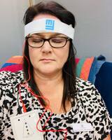 Gallery Photo of Stress management TMS session demo using the Fisher Wallace Stimulator/Circadia