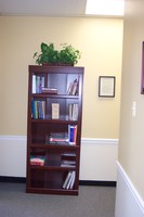 Gallery Photo of One of our many bookshelves for clinicians and clients to utilize.