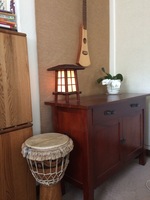 Gallery Photo of We have a number of musical instruments in our office -- this corner includes a Martin guitar and a djembe from Ghana.