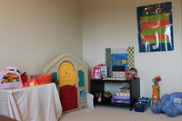 Gallery Photo of Here is the children's space with a variety of toys.
