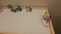 Gallery Photo of Sand therapy work with an adult client to process thoughts and emotions due to childhood trauma.
