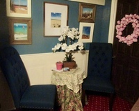 Gallery Photo of My waiting room has been totally remodeled for your pleasure and relaxation.  Sea blue, wainscoating and beach photos provide a soothing environment.