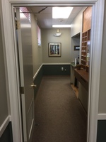 Gallery Photo of This hallway leads to the offices.  To the right is a hospitality area with water and coffee.