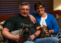 Gallery Photo of Dr. Liz and her husband, Mike Jenkins, MFT-I in the offfice with Pippin and Penny - our therapy dogs.