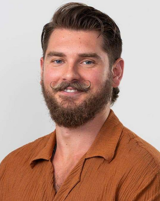 Photo of Jase George Dimos, Psychologist