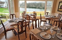 Gallery Photo of Dining room overlooking the pond