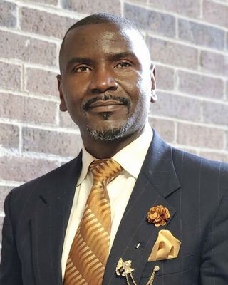 Photo of Kenneth Mutegyeki, Psychiatric Nurse Practitioner, BC, BSN, MSN