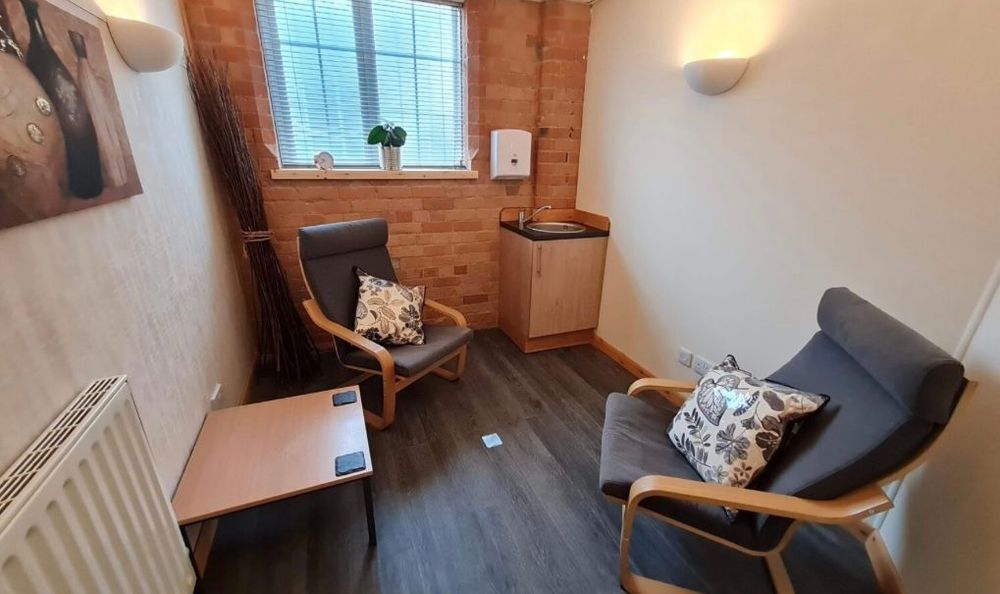 Comfortable, private therapy room for in-person sessions - designed to provide a safe, calming space where you can feel heard and supported.