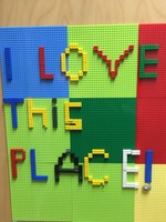 Gallery Photo of Children are expressive on the Lego wall.