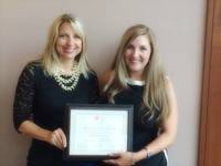 Gallery Photo of Being presented with the National Center Award of Excellence for Trauma Informed Care
