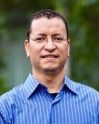 Photo of Dr. Reyes Alvarado, Psychiatric Nurse Practitioner