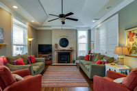 Gallery Photo of Villa Place family room with tv and fireplace