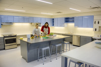 Gallery Photo of Our registered dietitian works in our Learning Kitchen teaching clients how good nutrition impacts the mind as well as the body.