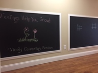 Gallery Photo of Engage your artistic side while you wait for your appointment with our new chalkboard wall!