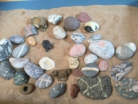 Gallery Photo of There's a beautiful collection of stones in my therapy room. Arranged in the sand-tray, they can help you tell your story and view things differently.