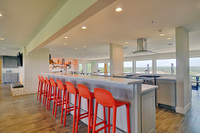 Gallery Photo of The free-flow design of the kitchen at Stonegate Center Hilltop, a place for women, hosts friendly banter over therapeutic culinary experiences.