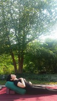 Gallery Photo of Restorative reclining pose is deeply healing, connecting our hearts with our highest self.