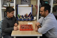 Gallery Photo of Using a game helps the child relax into the therapeutic process.