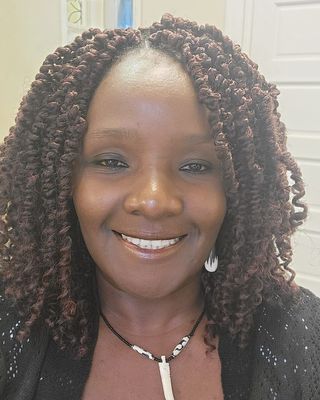 Photo of Dolly Ocholla, Marriage & Family Therapist, MA, CHES, LMFT
