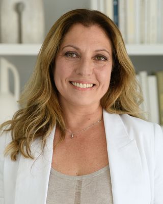 Photo of Angela Masuzzo, Registered Social Service Worker, RSSW, CYC, CHyp, NLPP