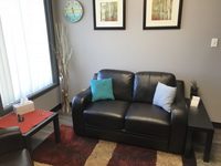 Gallery Photo of We really love comfy couches and pillows around here.