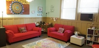 Gallery Photo of Room for group therapy, community support groups and workshops, child play therapy, and therapeutic art. Complimentary tea and coffee.