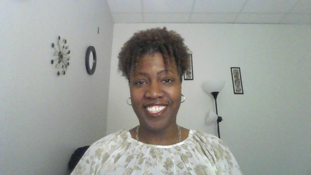 This is me sitting in my office between clients. I am happy because I enjoy what I do and like to see my clients make progress.