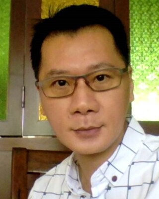 Photo of Krish Phua, MSocSci, CMSAC, Psychotherapist