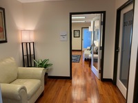 Gallery Photo of Entryway into the waiting room, with a bathroom on your immediate right.