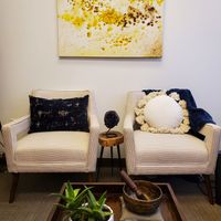 Gallery Photo of The office is filled with comfortable seating options, art, books, and hand selected items to create a calm atmosphere that is conducive to healing. 