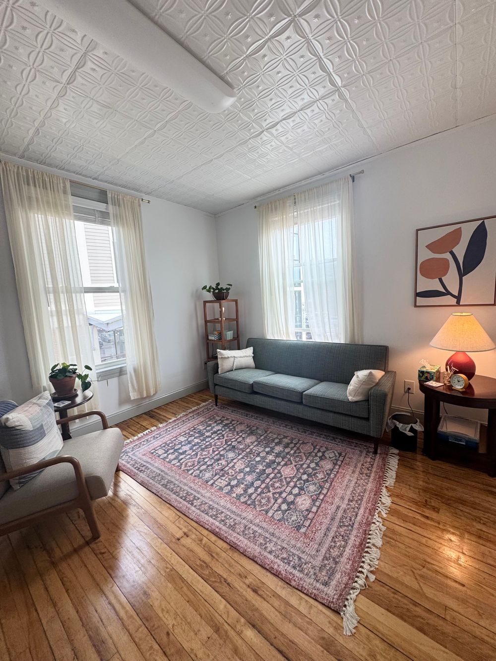 Lots of natural light and a couple of comfy places to sit.