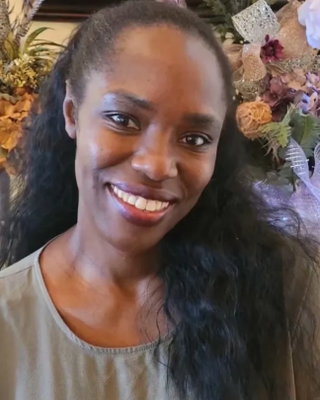 Photo of Esther Areba, Psychiatric Nurse Practitioner, DNP, PMHNP-B