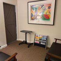 Gallery Photo of Waiting area, which comes with a laptop work station, for those parents that wish to do some work while their child is in treatment.