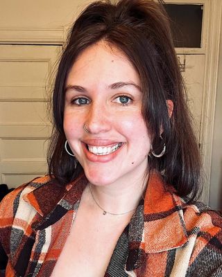 Photo of Lyzz Zinn, Counselor, MA, LMHC, MT-BC
