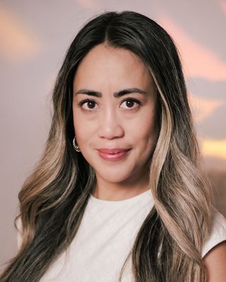 Photo of Isabel Ilumin, Registered Psychotherapist, MACP, BSW, BA